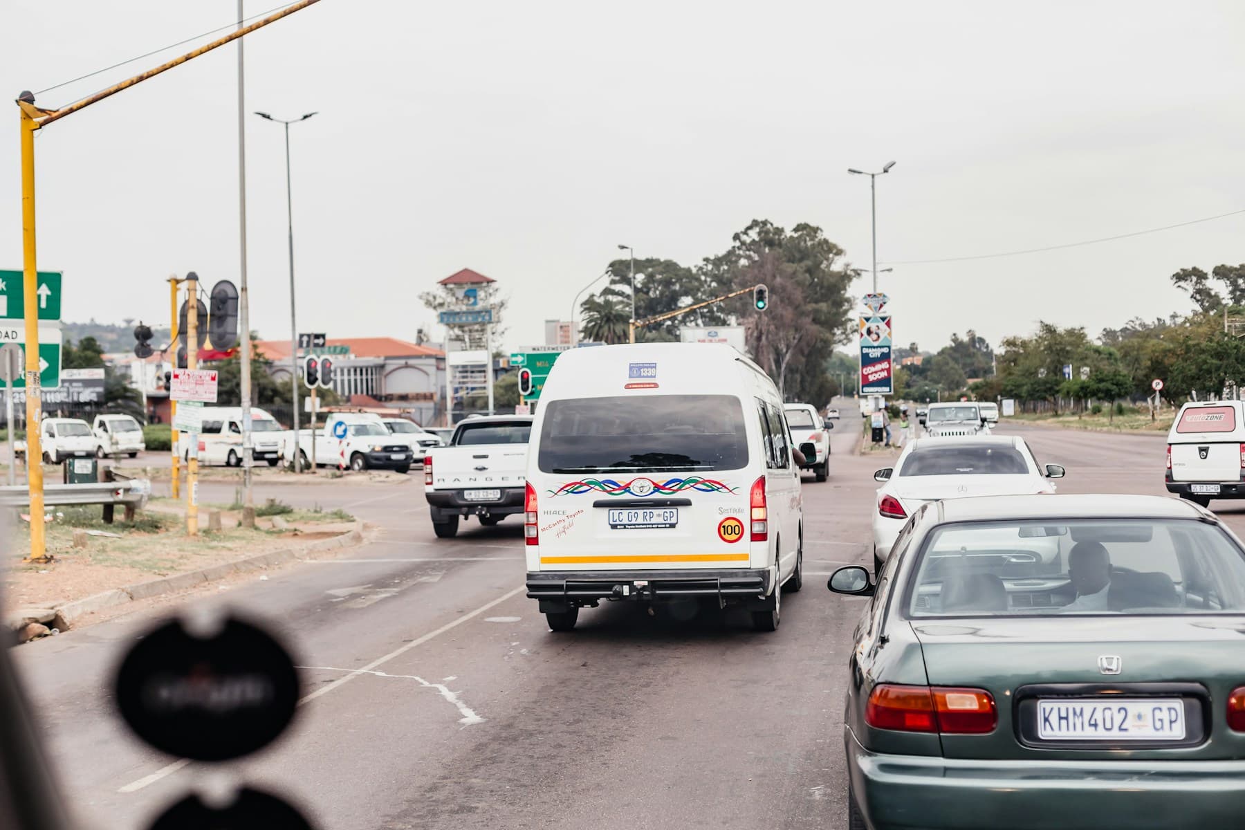 South African urban road scene with taxis and private vehicles