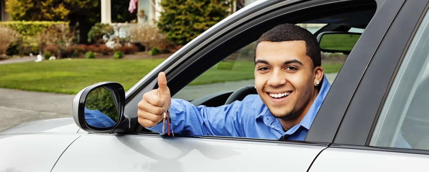 Illustrative driver seated in a vehicle