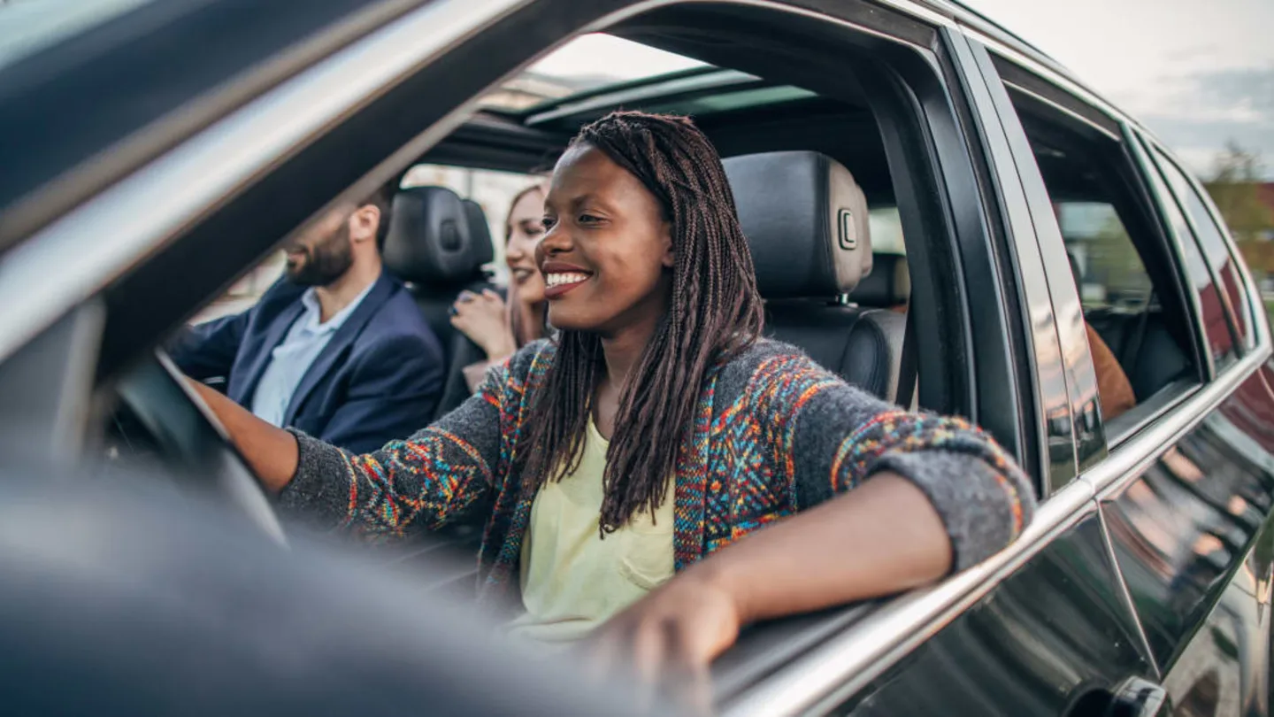 Illustrative e-hailing driver with passengers in a vehicle